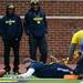 Former Michigan football player Chris Matsos dives into the end zone just short of a touchdown during the annual alumni flag football game before spring practice at Michigan Stadium on Saturday, April 13, 2013. Melanie Maxwell I AnnArbor.com